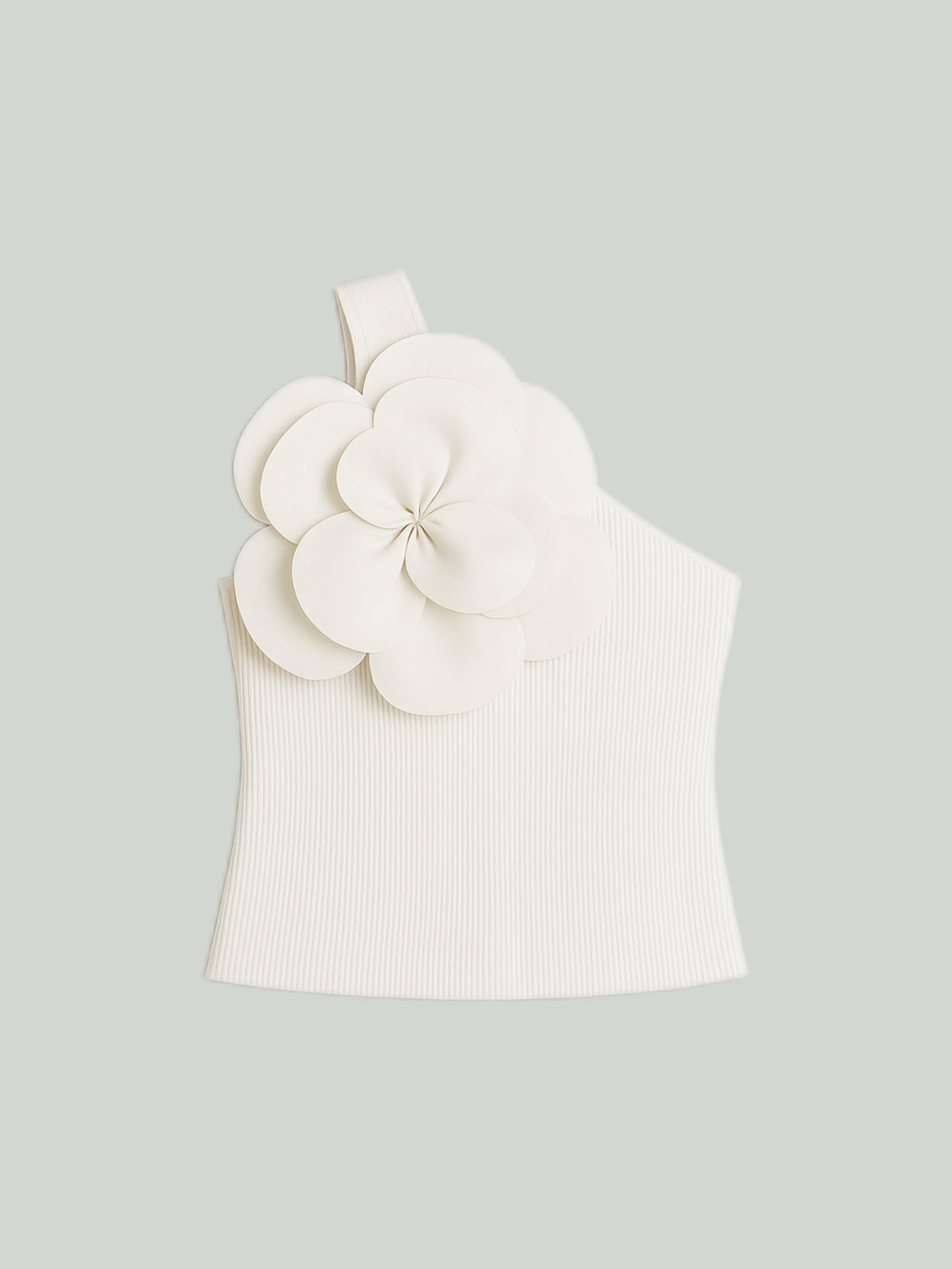 Top de punto con flores 3D y corte oversize